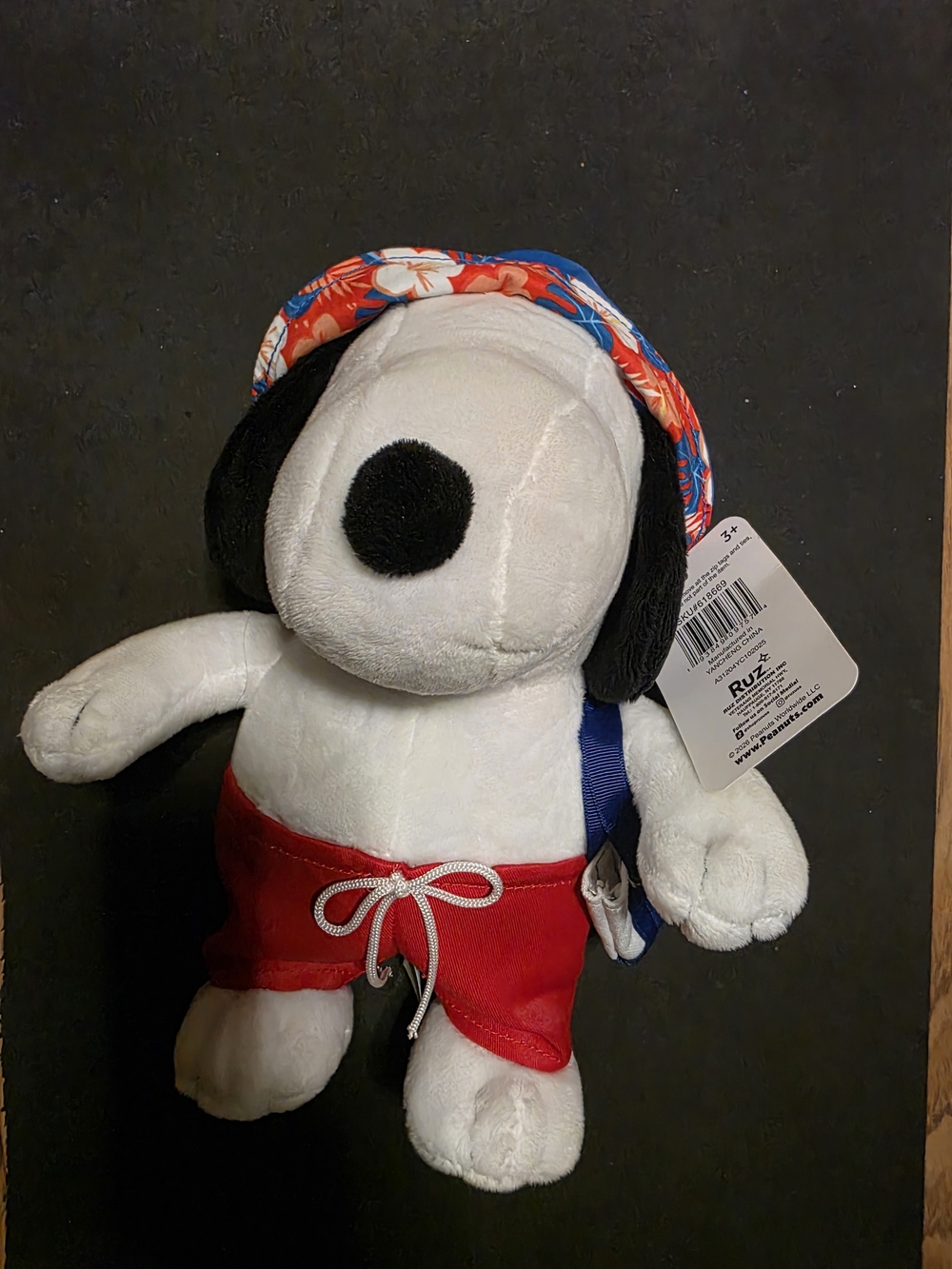 Snoopy Plush Dog Toy in White with Red Swim Trunks and Floral Hat